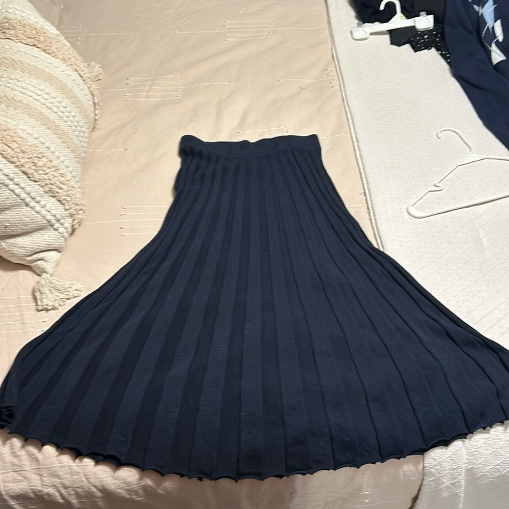 Pleated knit midi skirt.